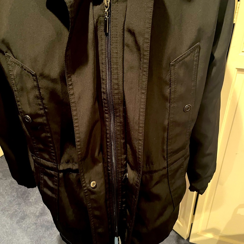 Size Large black hooded spring jacket. Ties, snaps and zips.